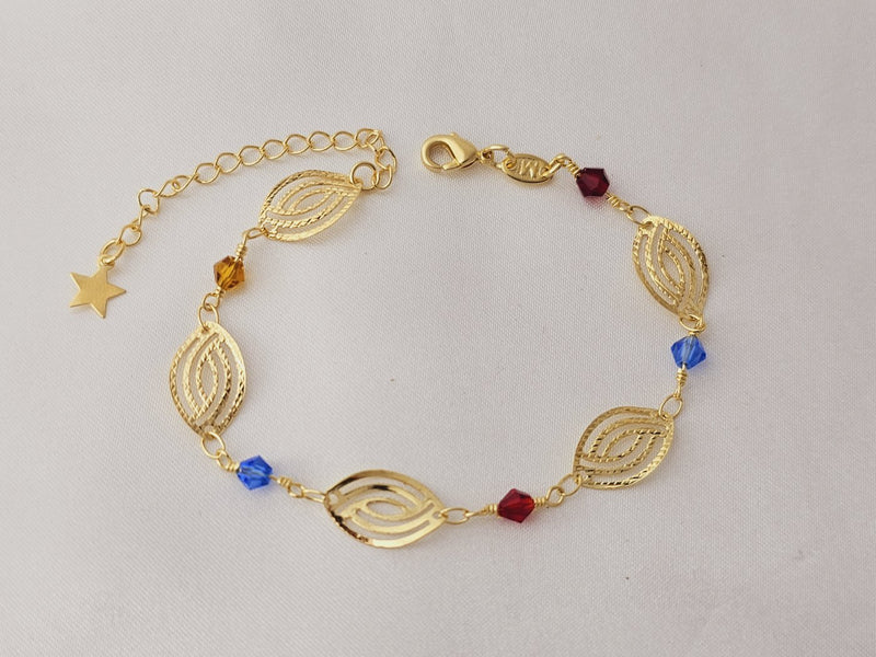 Pulseira com geométrico oval vazado e pedras sintéticas coloridas, banhada a ouro, 22cm com extensor, estrela na ponta.