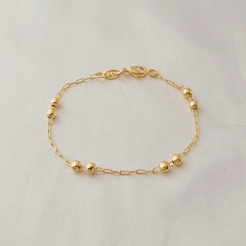 Pulseira cadeado com bolas duplas banhadas a ouro, medindo 16cm.